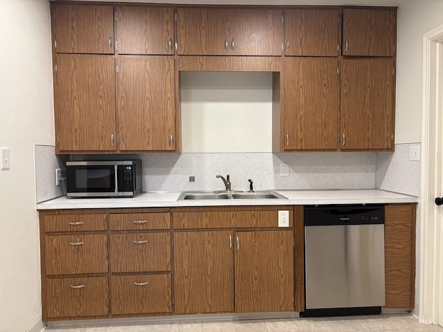 1715 S 10th Ave, Caldwell, ID 83605 - kitchen featuring stainless steel appliances, backsplash, and light countertops