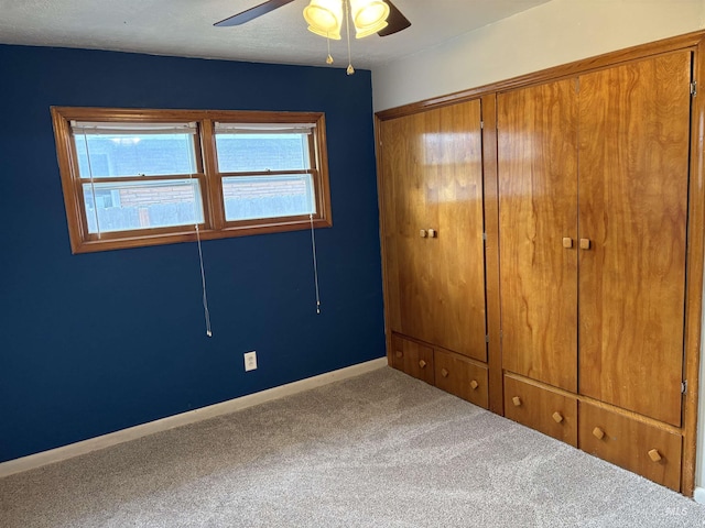 1715 S 10th Ave, Caldwell, ID 83605 - unfurnished bedroom featuring carpet, a closet, and a ceiling fan