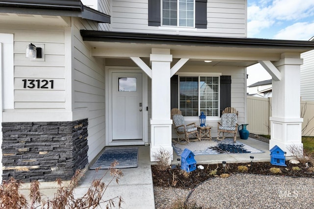 doorway to property with covered porch