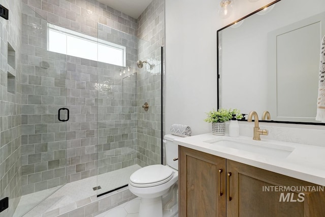 bathroom with walk in shower, tile patterned flooring, vanity, and toilet