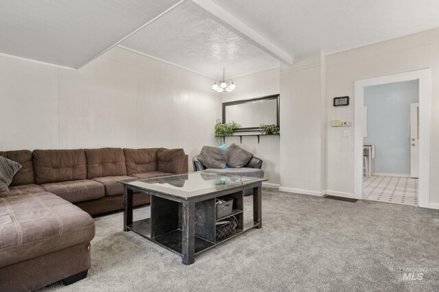 1406 Libby St, Clarkston, WA 99403 - carpeted living area with a chandelier, beam ceiling, and baseboards