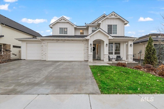 view of front facade with a front yard and a garage