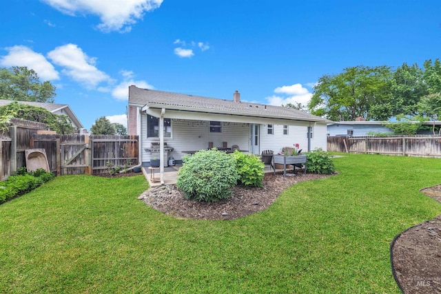 3509 8th St Unit C, Lewiston, ID 83501 - rear view of house featuring a patio and a chimney
