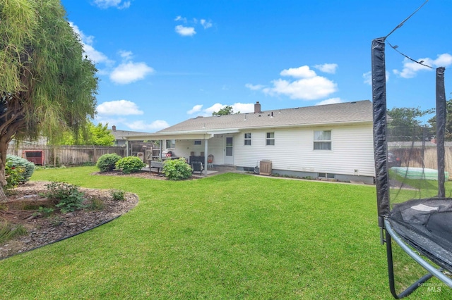 3509 8th St Unit C, Lewiston, ID 83501 - back of house with a patio, a trampoline, a chimney, and central AC unit
