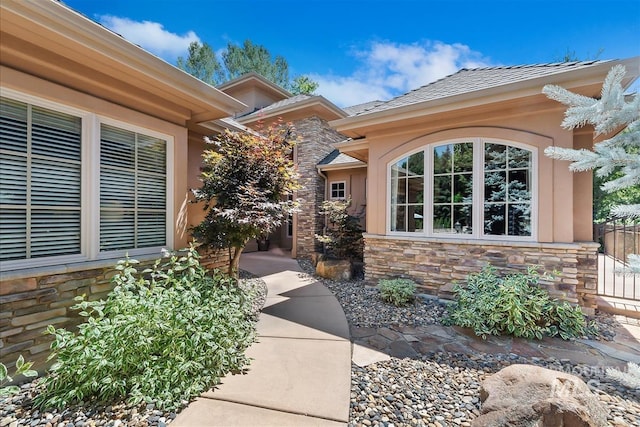 215 W Riverbridge Ln, Eagle, ID 83616 - view of exterior entry featuring stone siding and stucco siding