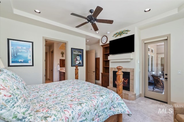 215 W Riverbridge Ln, Eagle, ID 83616 - bedroom with a tiled fireplace, carpet flooring, recessed lighting, ceiling fan, and ensuite bathroom