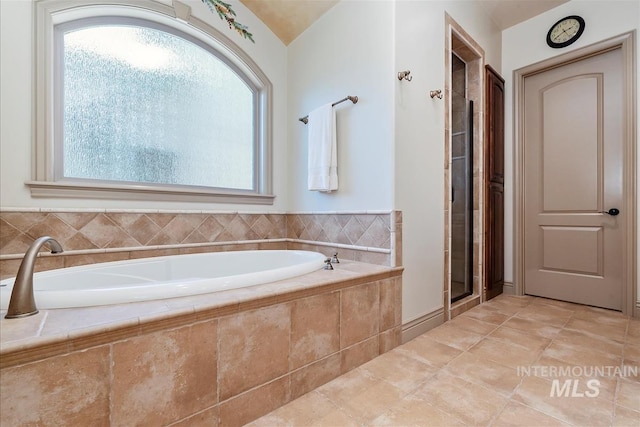 215 W Riverbridge Ln, Eagle, ID 83616 - bathroom with a bath and a shower with door