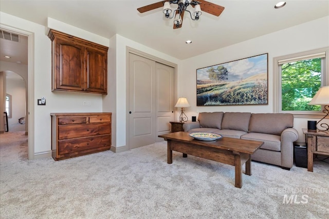 215 W Riverbridge Ln, Eagle, ID 83616 - living room featuring ceiling fan, arched walkways, light colored carpet, and recessed lighting