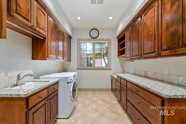 215 W Riverbridge Ln, Eagle, ID 83616 - washroom featuring washer and clothes dryer, cabinet space, and recessed lighting