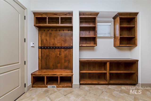 215 W Riverbridge Ln, Eagle, ID 83616 - mudroom featuring baseboards