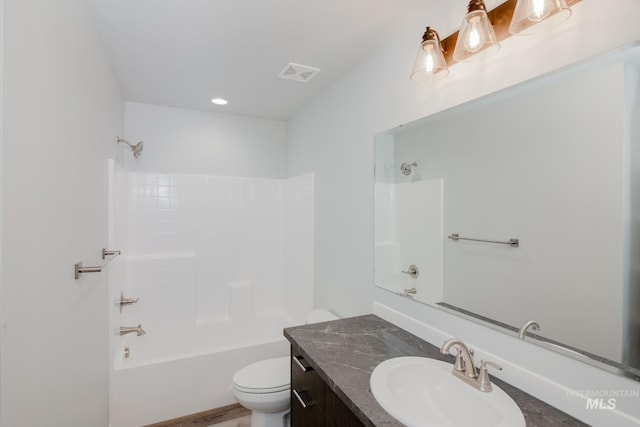 bathroom featuring vanity, visible vents, bathtub / shower combination, and toilet