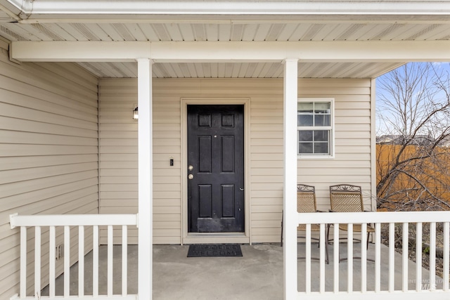 property entrance featuring covered porch