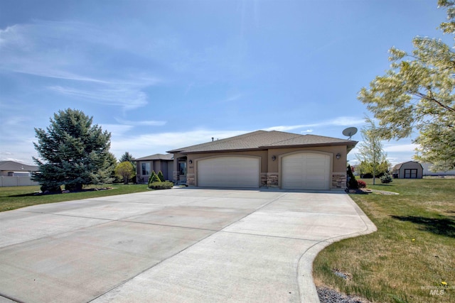 3623 E 3880 N, Kimberly, ID 83341 - ranch-style home with stone siding, a garage, concrete driveway, and a front lawn