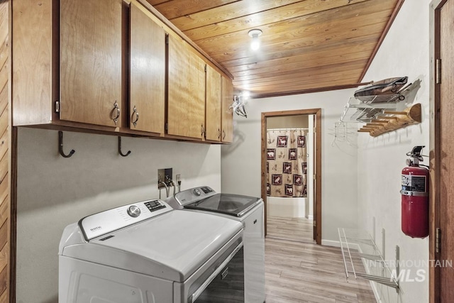 429 Doriann Dr, Cascade, ID 83611 - laundry area featuring separate washer and dryer, wooden ceiling, cabinet space, light wood-style flooring, and baseboards