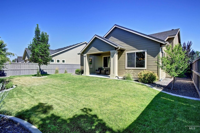 exterior space with a patio and a front lawn