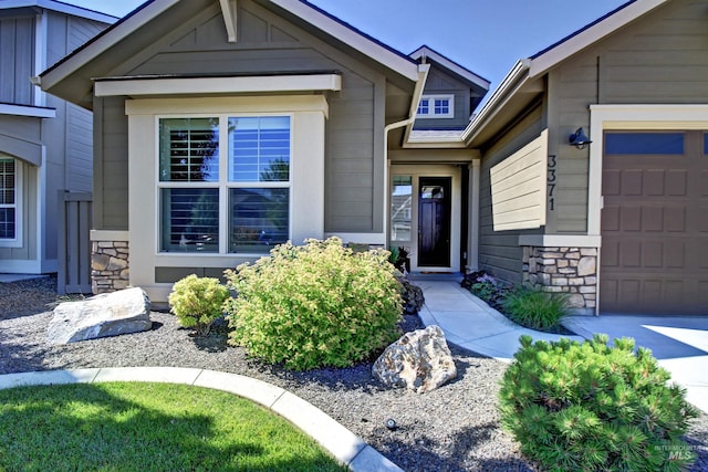 view of exterior entry featuring a garage