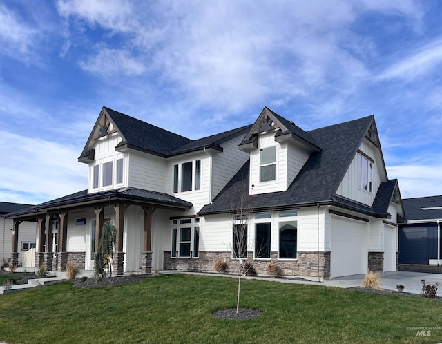 modern farmhouse with a porch, board and batten siding, an attached garage, and a front lawn