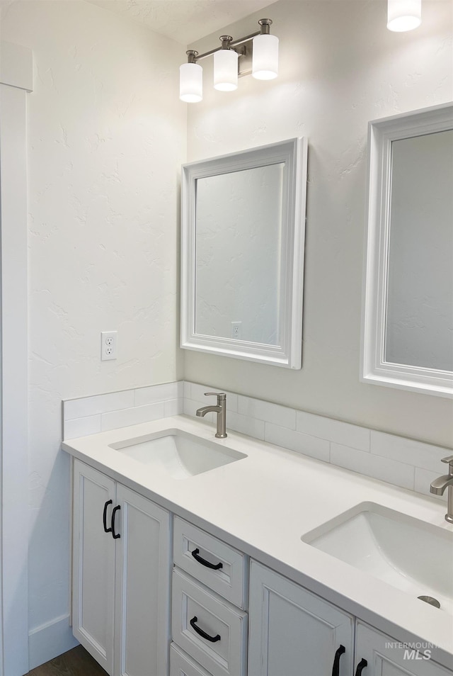 bathroom with double vanity and a sink