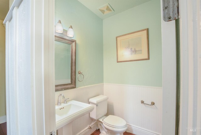 20169 Hoskins Rd, Caldwell, ID 83607 - bathroom featuring toilet and a wainscoted wall