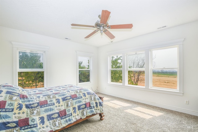 bedroom featuring ceiling fan and carpet floors