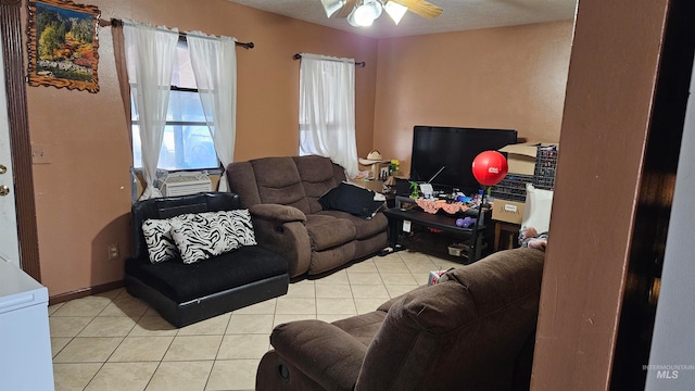 tiled living room featuring ceiling fan