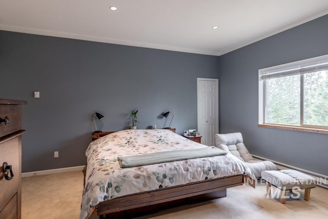 bedroom with baseboards, recessed lighting, crown molding, and light colored carpet