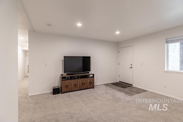 carpeted living room with baseboards and recessed lighting