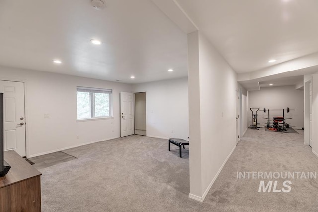 interior space featuring baseboards, carpet floors, and recessed lighting