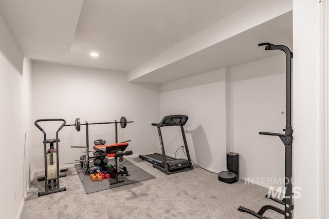 exercise area with carpet flooring, baseboards, and recessed lighting