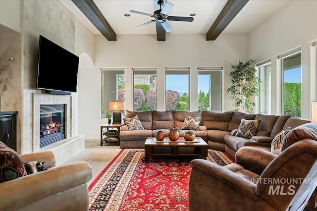 1480 N Colline Bello, Eagle, ID 83616 - living area with beam ceiling, carpet flooring, ceiling fan, and a high end fireplace