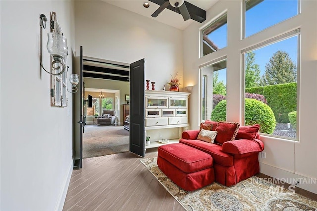 1480 N Colline Bello, Eagle, ID 83616 - living area with ceiling fan, a high ceiling, baseboards, and wood finished floors