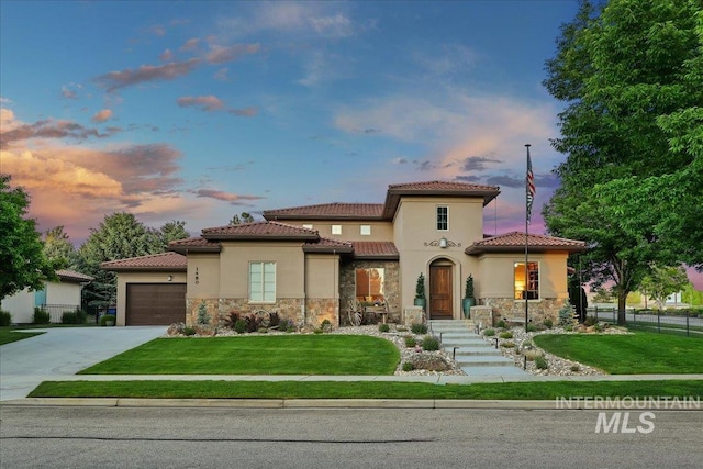 1480 N Colline Bello, Eagle, ID 83616 - mediterranean / spanish home featuring stone siding, concrete driveway, a garage, and stucco siding