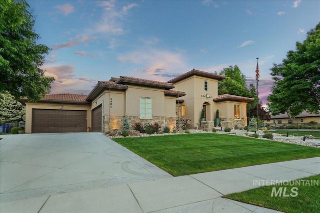 1480 N Colline Bello, Eagle, ID 83616 - mediterranean / spanish house featuring stone siding, driveway, a garage, and stucco siding