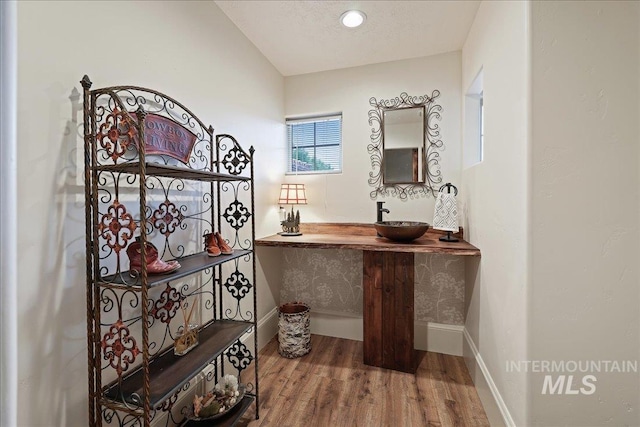 1480 N Colline Bello, Eagle, ID 83616 - bathroom with wood finished floors, baseboards, and vanity