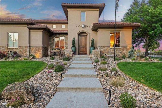 1480 N Colline Bello, Eagle, ID 83616 - view of front of property featuring stone siding, stucco siding, and a tile roof