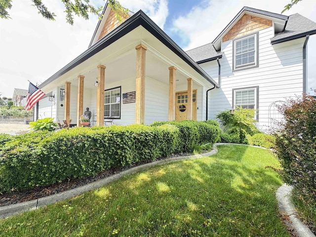 1128 30th St, Lewiston, ID 83501 - view of front of house with a front yard, a porch, and roof with shingles