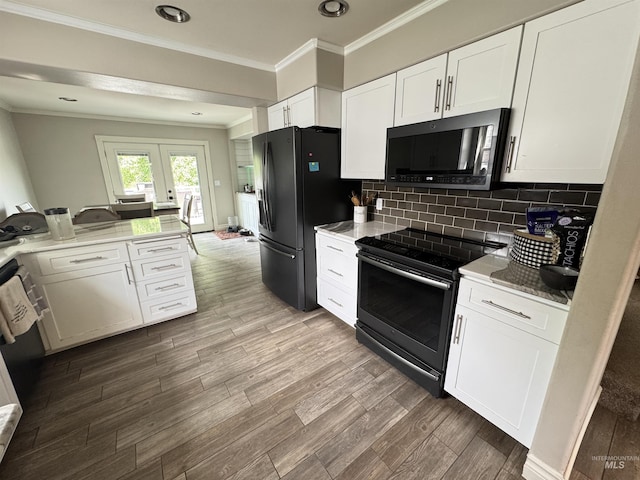 1128 30th St, Lewiston, ID 83501 - kitchen featuring black appliances, white cabinetry, wood finished floors, crown molding, and backsplash