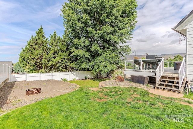 1128 30th St, Lewiston, ID 83501 - view of yard with an outdoor fire pit and a deck