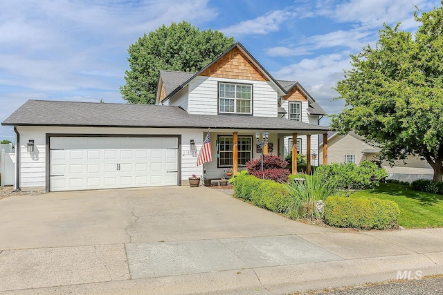 1128 30th St, Lewiston, ID 83501 - traditional-style home with covered porch, an attached garage, driveway, and a shingled roof