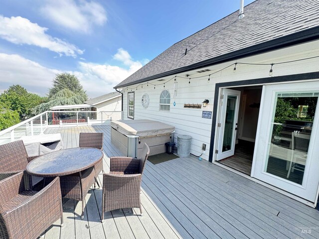 1128 30th St, Lewiston, ID 83501 - deck featuring a hot tub and outdoor dining area