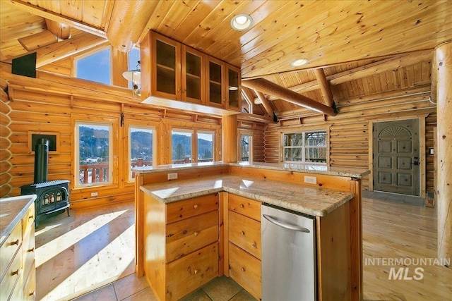 kitchen featuring a wood stove, wooden ceiling, light stone counters, high vaulted ceiling, and beamed ceiling