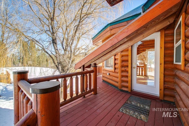 view of snow covered deck