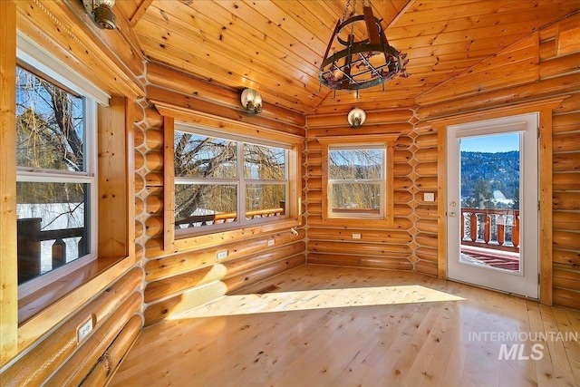 unfurnished sunroom with vaulted ceiling and wooden ceiling