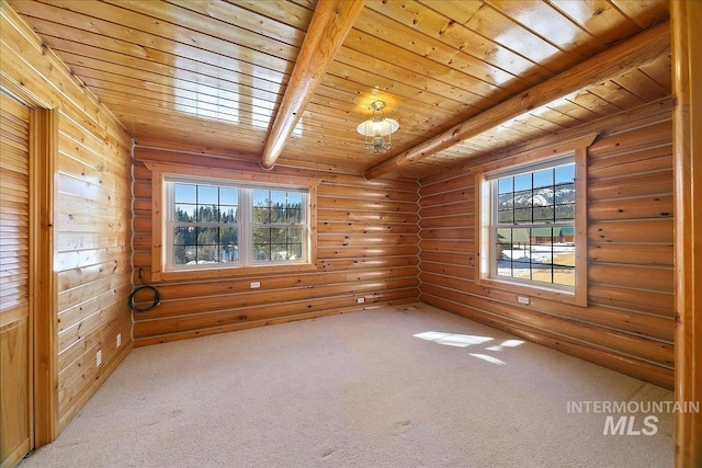 spare room featuring rustic walls, beamed ceiling, carpet flooring, and wood ceiling
