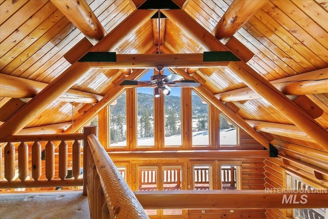 interior space featuring lofted ceiling with beams, carpet, and wooden ceiling