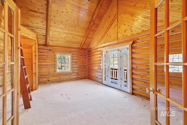 carpeted spare room with beamed ceiling, high vaulted ceiling, french doors, and wooden ceiling