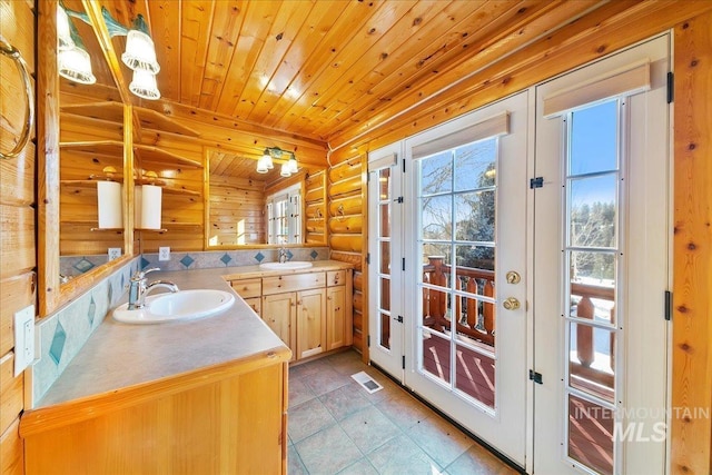 bathroom with vanity, wood ceiling, french doors, and tile patterned floors