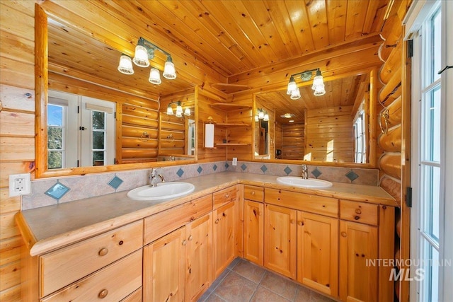 bathroom with tile patterned flooring, wooden ceiling, vanity, and log walls
