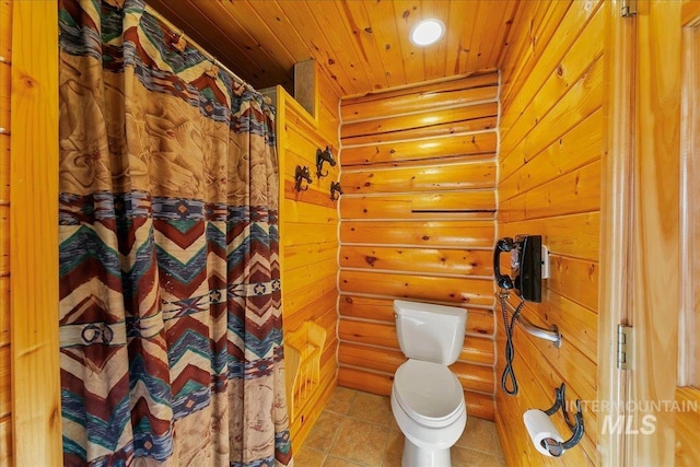 bathroom featuring wood ceiling, toilet, and tile patterned floors