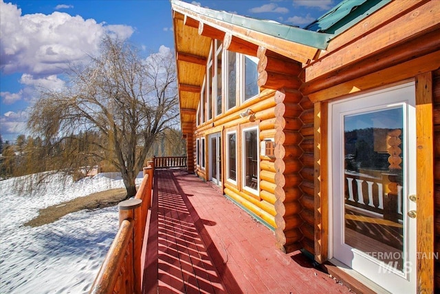 view of snow covered deck